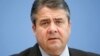 FILE - Sigmar Gabriel speaks during a press conference in Berlin, Nov. 4, 2015. 