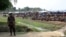 FILE - A soldier stands near the Cox's Bazar refugee camp in Bangladesh, near Rakhine state, Myanmar, during a trip by United Nations envoys to the region, April 29, 2018. 