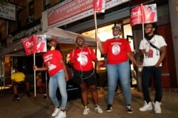Volunteers for and supporters of longtime U.S. Rep. Yvette Clarke, D-N.Y., gather outside Clarke's campaign headquarters, June 23, 2020, in the Brooklyn borough of New York, as they awaited the arrival of the congresswoman.