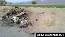 Photo taken on cellphone purports to show the destroyed vehicle in which Mullah Mohammad Akhtar Mansour was traveling in the Ahmad Wal area in Baluchistan province of Pakistan, near Afghanistan's border, May 22, 2016.