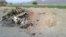 Photo taken on cellphone purports to show the destroyed vehicle in which Mullah Mohammad Akhtar Mansour was traveling in the Ahmad Wal area in Baluchistan province of Pakistan, near Afghanistan's border, May 22, 2016.