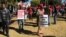 Members of the Movement for Democratic Change Alliance are planning to protest July 25, 2018, in Harare to force the Zimbabwe Electoral Commission to give in to their demands. Here, protesters accuse the elections body of plotting to rig the vote for the ruling Zanu PF party, July 11, 2018. (S. Mhofu/VOA)