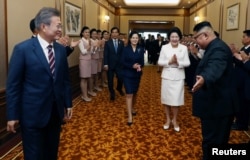 South Korean President Moon Jae-in and North Korean leader Kim Jong Un arrive at the Paekhwawon State Guesthouse in Pyongyang, North Korea, September 18, 2018.