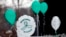 FILE - Balloons are displayed outside a doctor's office on the first anniversary of the Sandy Hook massacre, in Newtown, Connecticut, Dec. 14, 2013. 