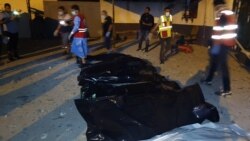Emergency workers recover bodies after an airstrike killed nearly 40 at Tajoura Detention Center, east of Tripoli on early July 3, 2019.