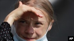 FILE - Climate activist Greta Thunberg attends a news conference following a meeting with German Chancellor Angela Merkel in Berlin, Germany, Aug. 20, 2020. 