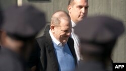 FILE - Harvey Weinstein arrives at the first precinct while turning himself to authorities following allegations of sexual misconduct, in New York, May 25, 2018.