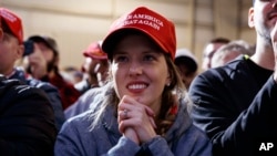 FILE - Supporters of President Donald Trump listen to him speak during a campaign rally at Columbia Regional Airport, Nov. 1, 2018, in Columbia, Mo.