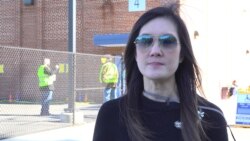 A Thai American first-time voter, Kajornpart Srisuda talks with VOA Thai at a polling station on Election Day in Springfield, VA, U.S., November 3, 2020.