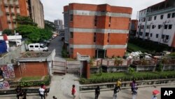 A passenger on a Liberia flight carried the Ebola virus to Nigeria's red-brick First Consultant Hospital in Lagos. Nigeria has contained the virus, so far.