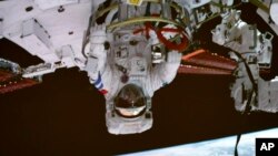 FILE - In this photo released by Xinhua News Agency, screen image captured at the Beijing Aerospace Control Center on Sept. 1, 2022 shows Shenzhou-14 astronaut Chen Dong. Final preparations were being made Monday for the Shenzhou-15 mission.