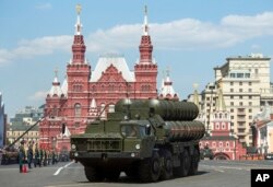 FILE - Russian S-400 air defense missile systems drive during the Victory Day military parade marking 71 years after the victory in WWII in Red Square in Moscow, Russia, May 9, 2016.