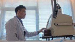 This photo taken on Nov. 5, 2021 shows Yang Kaiyuan (R), a cosmetic doctor at beauty clinic PhiSkin, checking equipment at the clinic in Shanghai.