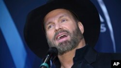 Musician Garth Brooks speaks in the press room after winning the award for entertainer of the year at the 51st annual CMA Awards at the Bridgestone Arena, Nov. 8, 2017, in Nashville, Tennessee.