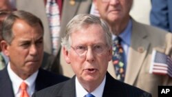 FILE - Senate Minority Leader Mitch McConnell, R-Ky., speaks as members of Congress hold a ceremony to remember the terror attacks of September 11, 2001, on the steps of the Capitol in Washington.