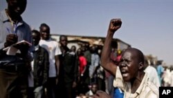 A southern Sudanese man chants pro-independence slogans outside a polling station in the southern capital of Juba Sunday, Jan. 9, 2011