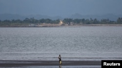 Infrastructure of Myanmar is pictured from the Teknaf area of the Myanmar-Bangladesh border, during the ongoing conflict in the Rakhine state of Myanmar, in Cox's Bazar Bangladesh, June 24, 2024.