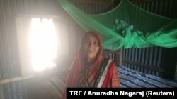 Tara Khokon Miya is seen in her village home in Shipur, Bangladesh, Feb. 26, 2018. She is helping to prepare her 27-year-old daughter to testify via videoconferencing technology against the men who trafficked her to India.