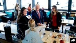 Democratic presidential candidate former Vice President Joe Biden greets guests at Ross' Restaurant, Jan. 6, 2020, in Bettendorf, Iowa.