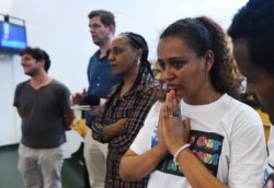 Hiwet Tesfamarian, sister of Medhane Tesfamariam Berhe, reacts after hearing the verdict in the case of an alleged people-smuggling kingpin identified by the court as Medhanie Yehdego Mered, who claims his identity has been mistaken, Palermo, Italy.