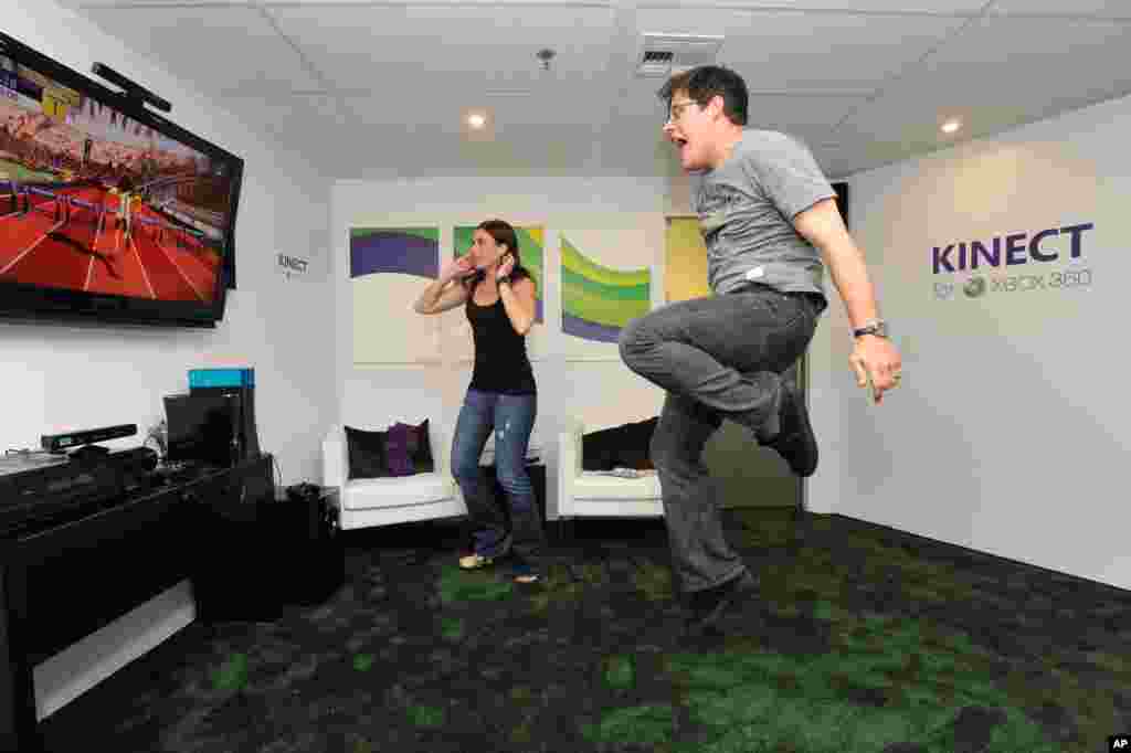 In this photograph taken by AP Images for Xbox, Actor Rich Sommer plays Kinect on Xbox 360 at the Xbox booth during the E3 2010 conference held at the Los Angeles Convention Center in Los Angeles on June 15, 2010. 