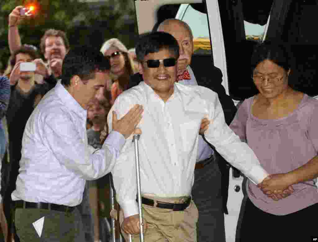 Blind Chinese legal activist Chen Guangcheng arrives at Washington Square Village on the campus of New York University, May 19, 2012, in New York.