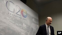 European Financial Affairs Commissioner Pierre Moscovici arrives to give a press conference during the G-20 meeting of finance ministers and central bank governors in Buenos Aires, Argentina, July 22, 2018. 