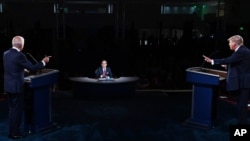 FILE - President Donald Trump and Democratic presidential candidate Joe Biden participate in the first presidential debate, Sept. 29, 2020, at Case Western Reserve University and Cleveland Clinic, in Cleveland. 