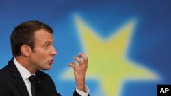 French President Emmanuel Macron delivers a speech on the European Union at the amphitheater of the Sorbonne university in Paris, Sept. 26, 2017. Macron is laying out his vision for a more unified Europe despite Brexit looming.