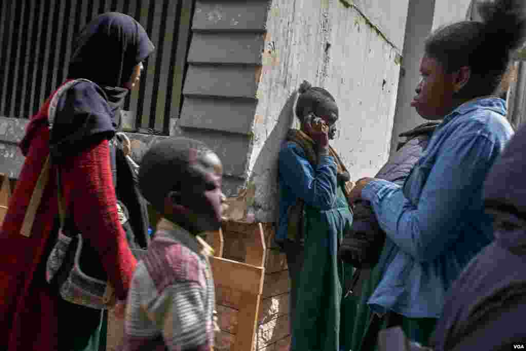 Some African refugee students during a school break in Cairo. Some Sudanese youngsters whose families cannot afford their education, leave school. Sometimes the children become involved in illegal behavior to make their living. (H. Elrasam/VOA)