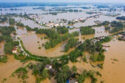 FILE - An aerial view shows the flooded Gu town following heavy rainfall in the region, in Luan, Anhui province, China, July 20, 2020.