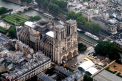 This aerial picture taken on June 12, 2019 in the French capital Paris shows the Notre Dame de Paris cathedral under repair after it was badly damaged by a huge fire on April 15.