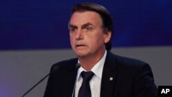 Jair Bolsonaro, who is running for president from the National Social Liberal Party, attends a presidential debate in Sao Paulo, Brazil, Aug. 9, 2018. Brazil will hold general elections on Oct. 7.