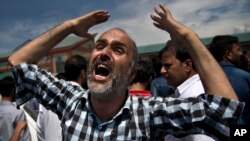 A Kashmiri Muslim man shouts pro-freedom slogans while protesting against the killing of civilian outside a local hospital in Srinagar, Indian-controlled Kashmir, Aug. 24, 2016. The civilian died of pellet injuries as protests continued in the valley afte