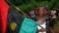FILE - A man carries the Biafran flag during a parade in Ekwe village, near Enugu, southeastern Nigeria.