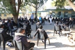 Learners in Gaborone practise social distancing while being addressed by their teachers on the opening day. (Photo: Mqondisi Dube)