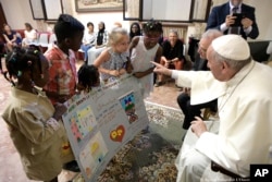 Pope Francis meets refugee children in St. John Lateran Basilica in Rome.