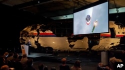 A video show the impact of a missile on Malaysia Airline Flight 17 during a press conference in Gilze-Rijen, the Netherlands, Oct. 13, 2015.