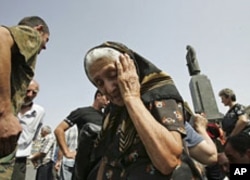 Georgian refugees from surrounding villages, are seen at the central square in the town of Gori, northwest of the capital Tbilisi, Georgia, August 26, 2008