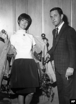 Barbara Feldon and Don Adams played spies in the television comedy "Get Smart." Here they show their weapons and gadgets. (Los Angeles, 1965.)