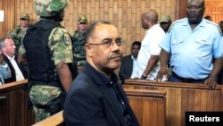 FILE - Mozambique's former finance minister Manuel Chang appears in court during an extradition hearing in Johannesburg, South Africa, Jan. 8, 2019. 