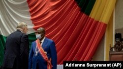 Central African Republic President Faustin-Archange Touadera, right, greets Russian ambassador Vladimir Efimovich Titorenko before being sworn in for a second term on March 30, 2021. (AP Photo)