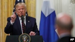 President Donald Trump speaks during a news conference with and Finnish President Sauli Niinisto (not pictured) at the White House in Washington, Oct. 2, 2019. 