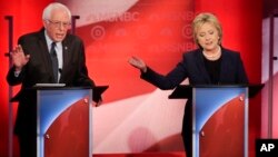 Democratic presidential candidate, Sen. Bernie Sanders, I-Vt, and Democratic presidential candidate, former Secretary of State Hillary Clinton spar during a Democratic presidential primary debate hosted by MSNBC at the University of New Hampshire Thursday, Feb. 4, 2016, in Durham, N.H. (AP Photo/David Goldman)