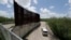 U.S. Customs and Border Patrol patrol along the border fence, June 27, 2018, in Hidalgo, Texas. 