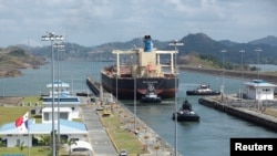 FILE - A bulk carrier moves through the Cocoli Locks at the Panama Canal, on the outskirts of Panama City, April 19, 2023. 