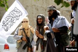 Taliban celebrate ceasefire in Ghanikhel district of Nangarhar province, Afghanistan, June 16, 2018.