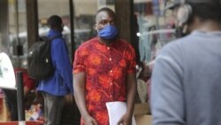 Emmanuel Reyai walks on the streets of Harare while looking for a job, Wednesday, Aug, 5, 2020.