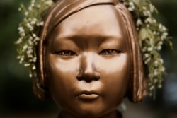 A statue commemorating so-called "comfort women," a euphemism given by Japan to the women and girls enslaved for sex by the Japanese army during World War II, in a residential area in central Berlin, Germany on October 9, 2020. Markus Schreiber/AP