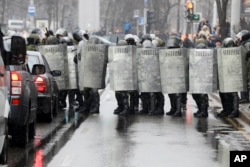 Belarus police block a street during an opposition rally in Minsk, March 25, 2017. Police in the Belarusian capital have begun wide-scale arrests protesters who had gathered for a forbidden demonstration that they hoped would build on a rising wave of defiance of the former Soviet republic's authoritarian government.